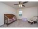 Comfortable Bedroom with soft carpet, rocking chair, and charming decor, perfect for a baby's room at 141 Clydesdale Cir, Summerville, SC 29486