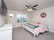 Bright bedroom with natural light, bed with pink details, and a cozy ceiling fan at 141 Clydesdale Cir, Summerville, SC 29486