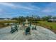Community space with fire pit, Adirondack chairs, and a water feature offering a relaxing outdoor retreat at 141 Clydesdale Cir, Summerville, SC 29486