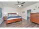 Spacious main bedroom with hardwood floors, ceiling fan, and a large bed with matching dresser at 141 Clydesdale Cir, Summerville, SC 29486