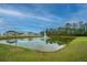 Scenic pond with a fountain and lush greenery, creating a peaceful and picturesque community setting at 141 Clydesdale Cir, Summerville, SC 29486
