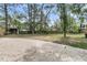 Expansive backyard featuring mature trees, a lawn, and a gravel area at 1541 Hutton Pl, Charleston, SC 29407