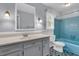 Bathroom with blue tile, a large vanity, and a classic design at 1541 Hutton Pl, Charleston, SC 29407