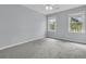 Cozy bedroom with plush carpet, neutral paint, and windows for natural light at 1541 Hutton Pl, Charleston, SC 29407