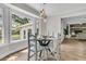 Bright dining area with large windows, modern lighting, and comfortable seating at 1541 Hutton Pl, Charleston, SC 29407