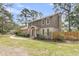 Charming two-story home with well-manicured lawn and mature trees at 1541 Hutton Pl, Charleston, SC 29407