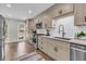 Well-lit kitchen boasts stainless appliances, white countertops, and ample cabinet space at 1541 Hutton Pl, Charleston, SC 29407