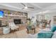 Cozy living room featuring a brick fireplace, modern furnishings, and wood-look flooring at 1541 Hutton Pl, Charleston, SC 29407