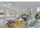 Bright living room boasts lots of natural light and is accented by light colored walls and blue furniture at 1541 Hutton Pl, Charleston, SC 29407