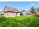 A detached garage and pristine lawn highlight this backyard at 1580 Cranes Nest Rd, Mount Pleasant, SC 29466
