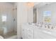 Stylish bathroom featuring double sinks, modern fixtures, and a glass enclosed shower at 1580 Cranes Nest Rd, Mount Pleasant, SC 29466