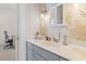 Stylish powder room with vanity, mirror, and elegant palm tree wallpaper at 1580 Cranes Nest Rd, Mount Pleasant, SC 29466