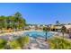 Large community pool with a zero entry and splash pad, surrounded by mature trees at 1580 Cranes Nest Rd, Mount Pleasant, SC 29466