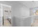 Bright upstairs hallway leading to a bedroom, offering seamless transition and natural light at 1580 Cranes Nest Rd, Mount Pleasant, SC 29466