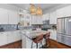 Well-lit kitchen with granite countertops, stainless steel appliances, white cabinets, and kitchen island at 1580 Cranes Nest Rd, Mount Pleasant, SC 29466