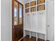 Mud room with dark wood floors and built-in storage space at 1580 Cranes Nest Rd, Mount Pleasant, SC 29466