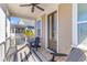 Comfortable front porch with 2 Adirondack chairs, a ceiling fan, and wooden floors at 1580 Cranes Nest Rd, Mount Pleasant, SC 29466