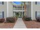 Close-up of a walkway leading to condos showcasing a well-maintained landscape at 1606 Whitby Ln, Charleston, SC 29414
