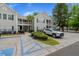 Condo building with accessible parking featuring neat landscaping and a modern, gray exterior at 1606 Whitby Ln, Charleston, SC 29414