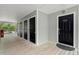 Condo hallway with several unit doors, light gray walls, and a wood-plank floor at 1606 Whitby Ln, Charleston, SC 29414