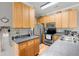 Functional kitchen with wood cabinets, stainless appliances, and ample counter space for meal preparation at 1606 Whitby Ln, Charleston, SC 29414