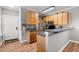 Efficient kitchen featuring wood cabinetry, stainless steel appliances, and a breakfast bar for casual dining at 1606 Whitby Ln, Charleston, SC 29414