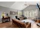 Bright living room with hardwood floors, a ceiling fan, and a large window at 1606 Whitby Ln, Charleston, SC 29414