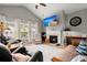 Bright living room with vaulted ceilings, fireplace, and comfortable seating, creating a cozy atmosphere at 1606 Whitby Ln, Charleston, SC 29414