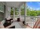 Relaxing screened-in porch featuring comfortable seating and peaceful outdoor views at 1606 Whitby Ln, Charleston, SC 29414