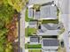 Aerial view of neighborhood featuring a green backyard, surfboard rack, garage, and white privacy fence at 1753 Bee Balm Rd, Johns Island, SC 29455