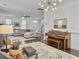 Bright open living room with hardwood floors, white walls, and modern furniture at 1753 Bee Balm Rd, Johns Island, SC 29455