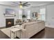 Cozy living room with a fireplace, hardwood floors, and a comfy sectional sofa at 1753 Bee Balm Rd, Johns Island, SC 29455