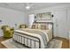 Bright main bedroom featuring hardwood floors, white walls, and neutral decor at 1753 Bee Balm Rd, Johns Island, SC 29455