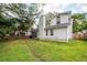 Expansive backyard featuring mature trees, grassy lawn, and privacy fence at 1922 Cedar Petal Ln, Charleston, SC 29414