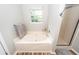 Soaking tub and a glass door shower enclosure are the highlights of this well-lit bathroom at 1922 Cedar Petal Ln, Charleston, SC 29414