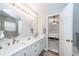 Double sink bathroom has a doorway that leads into the main bedroom at 1922 Cedar Petal Ln, Charleston, SC 29414