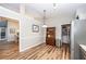 Open concept kitchen with stainless steel appliances, hardwood floors, and access to the dining area at 1922 Cedar Petal Ln, Charleston, SC 29414