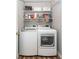 Functional laundry area with shelving, washer, and dryer at 1922 Cedar Petal Ln, Charleston, SC 29414