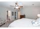 Relaxing bedroom with a ceiling fan includes the ensuite bathroom and walk-in closet at 1922 Cedar Petal Ln, Charleston, SC 29414