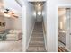 Carpeted staircase with a handrail provides access to the upper level, connecting multiple living spaces at 1922 Cedar Petal Ln, Charleston, SC 29414
