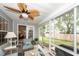 Cozy sunroom with comfortable seating, ceiling fan, and views of the backyard at 1922 Cedar Petal Ln, Charleston, SC 29414