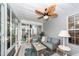Cozy sunroom with comfortable seating, ceiling fan, and plenty of natural light at 1922 Cedar Petal Ln, Charleston, SC 29414