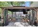 Backyard gazebo with plush furniture, patio and mounted television at 1938 Oak Tree Ln, Mount Pleasant, SC 29464