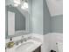 Well-lit bathroom with a marble countertop, modern faucet, and neutral decor, offering a clean and fresh feel at 1938 Oak Tree Ln, Mount Pleasant, SC 29464
