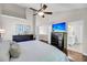 Main bedroom with vaulted ceilings, wood floors, and a private bathroom entrance at 1938 Oak Tree Ln, Mount Pleasant, SC 29464