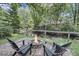 Outdoor fire pit area with comfortable seating and a view of the lush greenery at 1938 Oak Tree Ln, Mount Pleasant, SC 29464