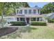 Charming two-story home with a welcoming front porch and manicured landscaping, located on a tree-lined street at 1938 Oak Tree Ln, Mount Pleasant, SC 29464