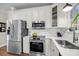 Bright kitchen with stainless steel appliances, subway tile backsplash and modern fixtures at 1938 Oak Tree Ln, Mount Pleasant, SC 29464