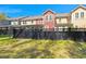 Exterior view of townhomes with private fenced backyard at 1992 Kings Gate Ln, Mount Pleasant, SC 29466