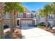 Charming two-story townhome featuring a garage, front yard landscaping, and a long driveway at 1992 Kings Gate Ln, Mount Pleasant, SC 29466